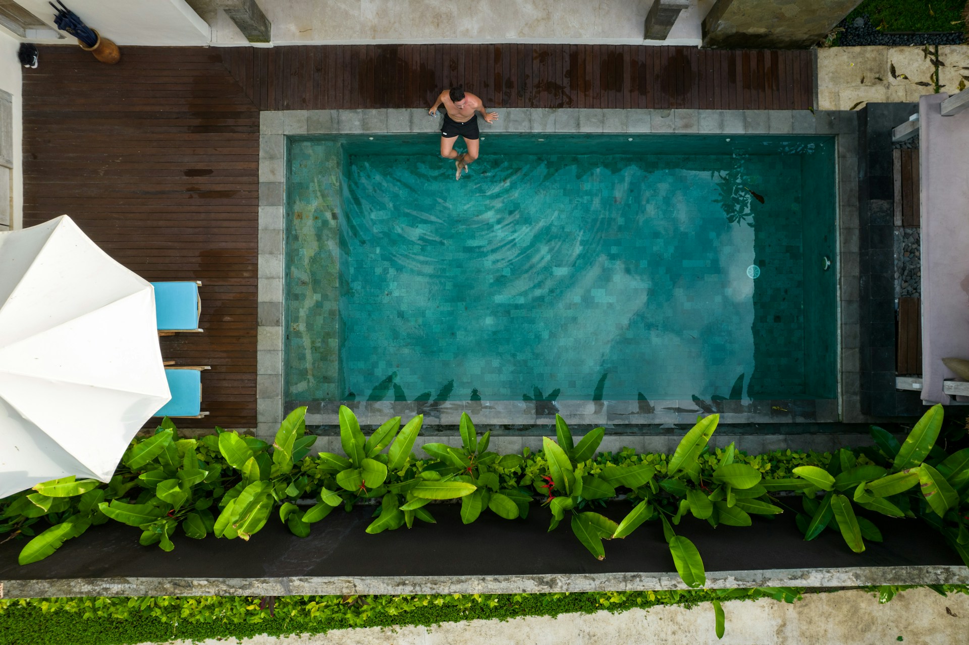 Aerial view of pool with Sukabumi stone and tropical garden